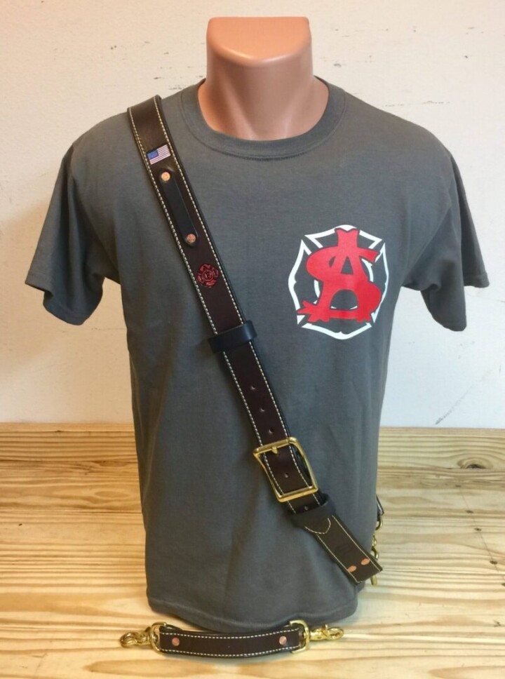 Gray shirt with leather strap on mannequin.